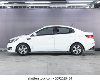 Novosibirsk, Russia - November 18, 2021:  White Kia Rio, Side View. Popular  Sedan On A Parking   