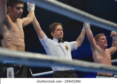 NOVOSIBIRSK, RUSSIA - NOVEMBER 29, 2014: Draw In The Match Evaldas Petrauskas Of Lietuva (right) Vs Carlos Aquino Of Argentina During AIBA Pro Boxing Tournament. The Winners Will Go To The Olympics