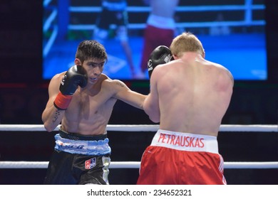 NOVOSIBIRSK, RUSSIA - NOVEMBER 29, 2014: Match Evaldas Petrauskas Of Lietuva (right) Vs Carlos Aquino Of Argentina During AIBA Pro Boxing Tournament. The Winners Will Go To The Olympics-2016