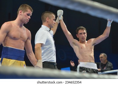 NOVOSIBIRSK, RUSSIA - NOVEMBER 29, 2014: Boris Georgiev Of Bulgaria Won The Match Against Viacheslav Kislitsyn Of Ukraine During AIBA Pro Boxing Tournament. The Winners Will Go To The Olympics-2016