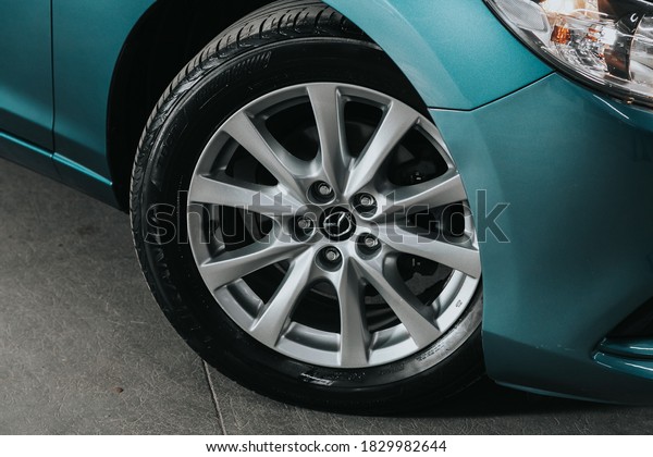 Novosibirsk, Russia – October 08, 2020: Mazda\
6,Car wheel with alloy wheel and new rubber on a car closeup. Wheel\
tuning disc\
