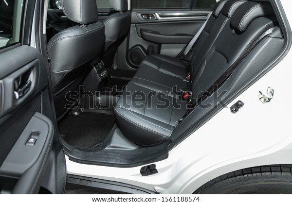 Novosibirsk, Russia – October 09, 2019: \
Subaru Outback , close-up of the black leather   rear seats with\
seats belt. modern car\
interior\
