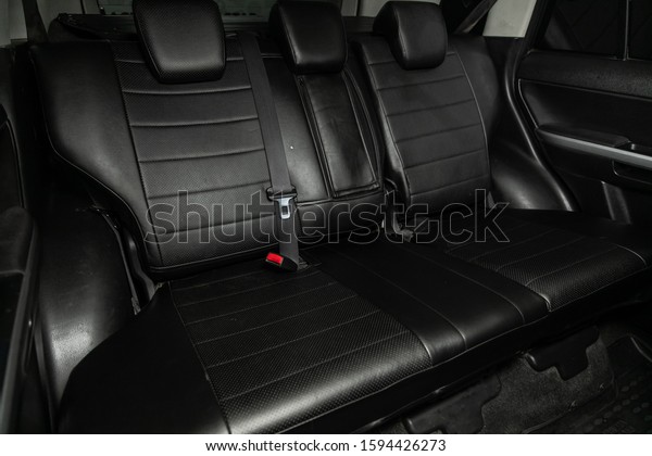 Novosibirsk, Russia – October 6, 2019:  Suzuki\
Grand Vitara, close-up of the black  leather rear seats with seats\
belt. modern car\
interior\
