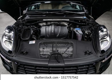 Novosibirsk, Russia – September 07, 2019:  Porsche Macan, Close up detail of  car engine, front view. Internal combustion engine, car parts, deteyling