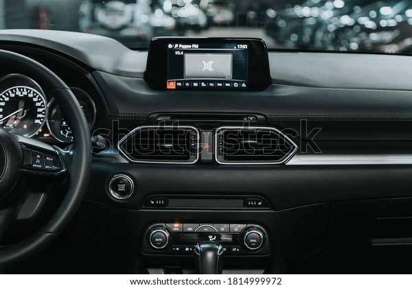 Novosibirsk, Russia – September 12, 2020 \
Mazda CX-5,close-up of the central control panel, monitor with\
music and radio , adjustment of the blower, air conditioner,\
player. modern car\
interior\

