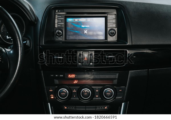 Novosibirsk, Russia – September 19, 2020: Mazda\
CX-5, close-up of the central control panel, monitor with music and\
radio , adjustment of the blower, air conditioner, player. modern\
car interior