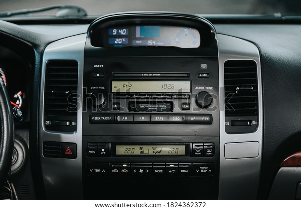 Novosibirsk, Russia – September 19, 2020: Toyota Land\
Cruiser Prado, close-up of the central control panel, monitor with\
music and radio , adjustment of the blower, air conditioner,\
player. 