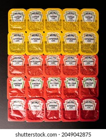 Novosibirsk, Russia - September 2, 2021 - A Set Of Different Heinz Sauces In A Package On A Dark Background. Top View. American Food Company, Renowned Ketchup Manufacturer