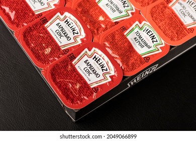 Novosibirsk, Russia - September 2, 2021 - A Set Of Different Heinz Sauces In A Package On A Black Table. Close-up. American Food Company, Renowned Ketchup Manufacturer