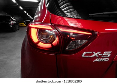 Novosibirsk, Russia – September 29, 2019:  close-up, the back of the car is a headlight, a bumper, a back cover of a baguette and an red Mazda CX-5 nameplate 