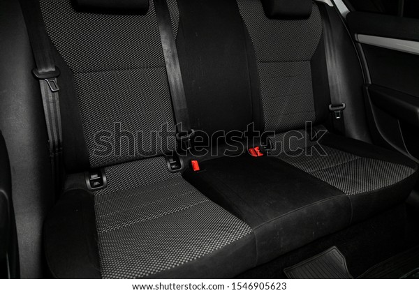 Novosibirsk, Russia – September 29, 2019: 
Scoda Octavia, close-up of the black  rear seats with seats belt.
modern car
interior

