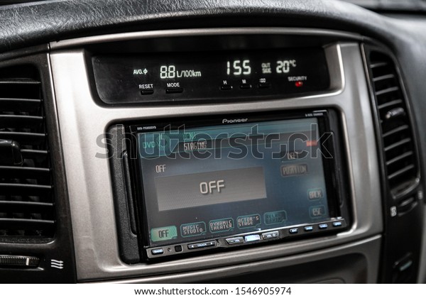 Novosibirsk, Russia – September 29,\
2019:  Toyota Land Cruiser  100, Modern black car interior: radio,\
tv, dvd,audio system with monitor  and control\
buttons\
\
