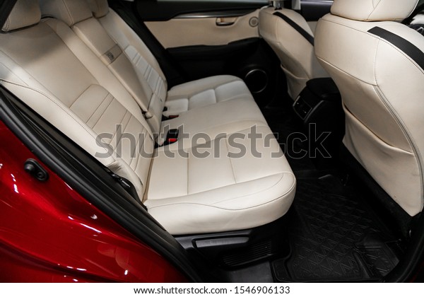 Novosibirsk, Russia – September 29, 2019: \
Lexus NX, close-up of the beige leather  rear seats with seats\
belt. modern car\
interior\
\
