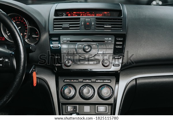 Novosibirsk, Russia – September 29, 2020:  \
Mazda 6, close-up of the central control panel, monitor with music\
and radio , adjustment of the blower, air conditioner, player.\
modern car\
interior\

