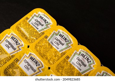 Novosibirsk, Russia - September 5, 2021 - A Set Of Heinz Sauces In A Package On A Black Table. Close-up. American Food Company, Renowned Ketchup Manufacturer