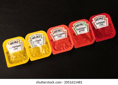 Novosibirsk, Russia - September 5, 2021 - A Set Of Heinz Sauces In A Package On A Black Table. American Food Company, Renowned Ketchup Manufacturer