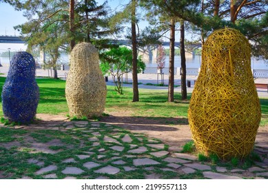 Novosibirsk, Siberia, Russia, 05.18.2022. Mikhailovskaya Embankment Of The Ob River. Garden Nesting Dolls In The Spring Park