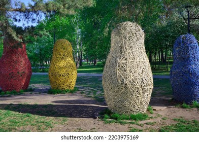 Novosibirsk, Siberia, Russia, 05.18.2022. Mikhailovskaya Embankment Of The Ob River. Garden Nesting Dolls In The Spring Park