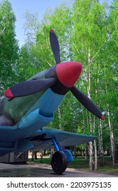  Novosibirsk, Siberia, Russia, 05.18.2022. Monument To The Plane In The Park. World War II Aircraft Among Spring Birches In The Park Of Glory