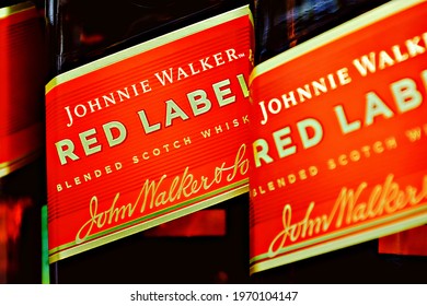 Novosibirsk,Russia - May, 2 - 2021: editorial selective focus photo of Johnnie Walker Red Label Scotch whisky bottles - a brand of Scotch whisky