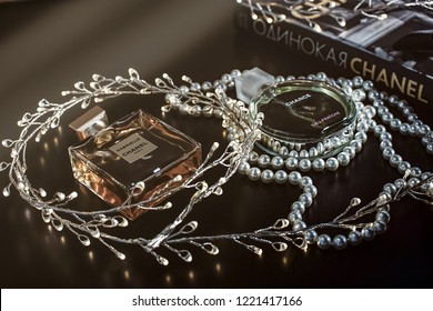 Novosibirsk,Russia- November 05, 2018: Chanel Perfume In The Style Of Magazine Shooting With A String Of Pearls And A Book.                  