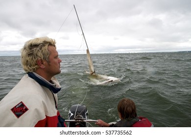 NOVOSIBIRSK,RUSSIA-JULY12:Sailing Regatta, Inter-regional Competition To Support Children's Sailing Siberiariver-2015, Sinking Yacht, July12, 2015 In Novosibirsk, Russia