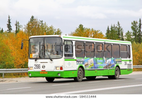 NOVYY URENGOY, RUSSIA - AUGUST\
31, 2012: White and green LIAZ 5256 city bus at the city\
street.