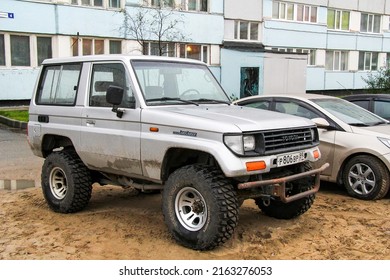 Novyy Urengoy, Russia - August 7, 2012: Grey Offroad Car Toyota Land Cruiser Prado 70 In A City Street.