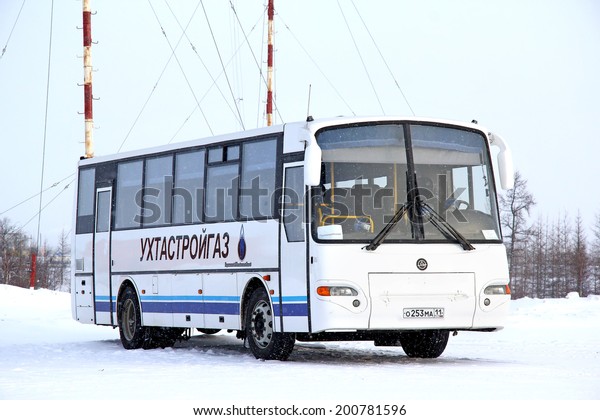 NOVYY URENGOY,\
RUSSIA - FEBRUARY 16, 2013: White KAVZ 4238 Avrora interurban coach\
at the city street.