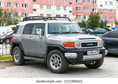 Novyy Urengoy, Russia - July 7, 2019: Grey Offroad Car Toyota FJ Cruiser In A City Street.