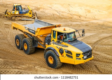 Novyy Urengoy, Russia - June 21, 2018: Yellow articulated dump truck Volvo A40F in the city street.