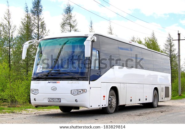 NOVYY URENGOY, RUSSIA - JUNE\
22, 2013: White Higer KLQ6119TQ interurban coach at the city\
street.