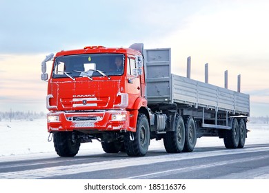 NOVYY URENGOY, RUSSIA - NOVEMBER 24, 2012: Orange KAMAZ 44108 semi-trailer trucks at the interurban road.