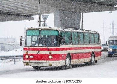 Novyy Urengoy, Russia - October 30, 2012: Old Soviet Coach Bus LAZ 699R Turist In A City Street During A Heavy Snowfall.