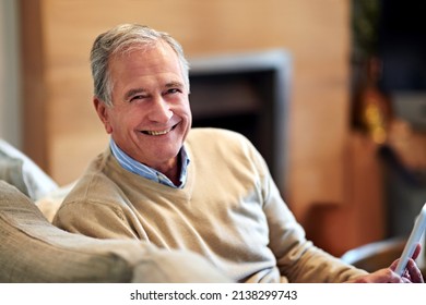 Now I Have More Of That Me Time. Shot Of A Senior Man Relaxing At Home.