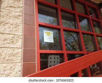 Now Hiring Interns Sign On Glass Window