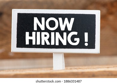 NOW HIRING Text Written On Small Chalkboard. Concept In Business