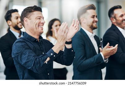 Now thats a standing ovation. Cropped shot of a group of businesspeople applauding during a seminar in the conference room. - Powered by Shutterstock