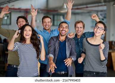 Now thats what I call team spirit. Joyous group of office staff jumping around and having fun together. - Shutterstock ID 2167990403
