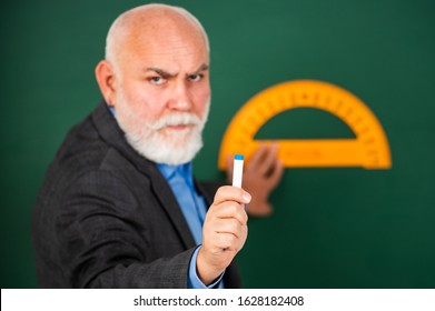 Now You Try. Back To School. Selective Focus. Education And School Concept. Home Learning. Senior Man Teacher Use Protractor Tool. Bearded Tutor Man Draw With Ruler On Blackboard.