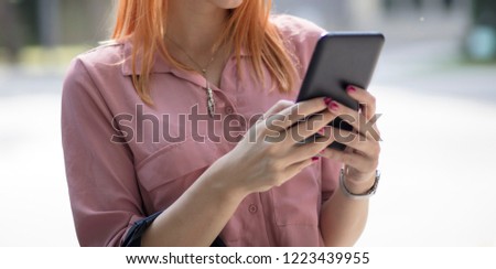 Similar – Young Woman Checking Her Mobile Phone