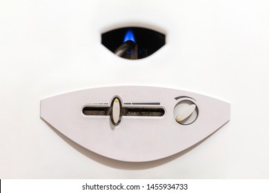 Nozzle And Fire Gas Boiler Close-up. White Background. The Boiler Is In Standby Mode. You Can See The Control Panel Of The Boiler. The Concept Of Carbon Monoxide Leakage And Poisoning.