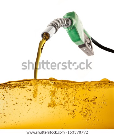Nozzle pumping gasoline in a tank