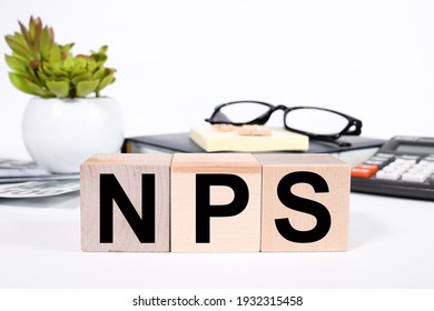 NPS. Text On Wood Cubes. Text In Black Letters On Wood Blocks