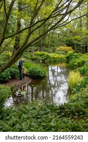 Nr. Wooler, Northumberland, UK: May 29th, 2022: People Admiring The Pond Garden At Lilburn Tower, A Mansion House Gardens Open Through The National Gardens Scheme.