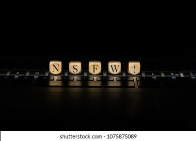 Nsfw word on wooden cubes. Nsfw concept