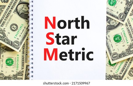 NSM North Star Metric Symbol. Concept Words NSM North Star Metric On White Note On A Beautiful Background From Dollar Bills. Business And NSM North Star Metric Concept. Copy Space.