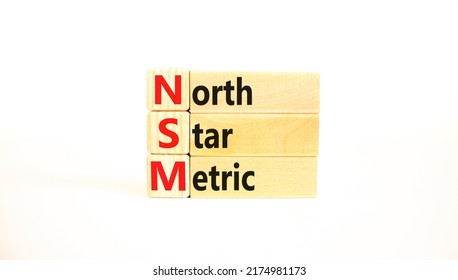 NSM North Star Metric Symbol. Concept Words NSM North Star Metric On Wooden Blocks On A Beautiful White Background. Business And NSM North Star Metric Concept. Copy Space.