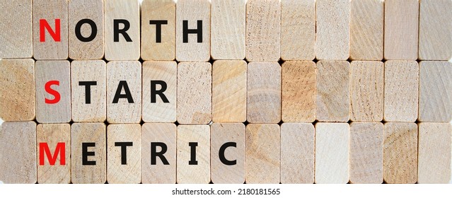 NSM North Star Metric Symbol. Concept Words NSM North Star Metric On Wooden Blocks On A Beautiful Wooden Background. Business And NSM North Star Metric Concept. Copy Space.