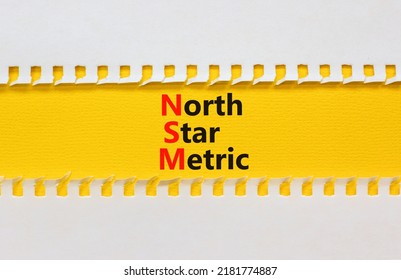 NSM North Star Metric Symbol. Concept Words NSM North Star Metric On Yellow Paper On A Beautiful White Background. Business And NSM North Star Metric Concept. Copy Space.